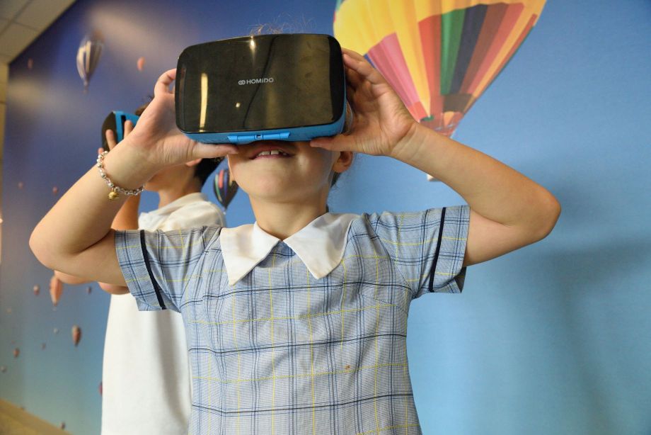 Kid playing with VR headset